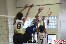 ND's Nolan Sablan gets up and over for a point for the Royals in the first set. (photo by Robert Balajadia)