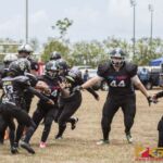 The Sindalu Raiders and SB Saints hit the gridiron in the opening week of the 2019 GWFTL Season. (photo by Bout It Productions)