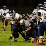 The Simon Sanchez Sharks defense bring down Guam High Panthers RaSean Jacobs. (Photo by Michael Blas)