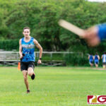 Southern Dolphin Carlos Leon Guerrero finishes first overall with a time of 17:34. (Photo by Michael Blas)