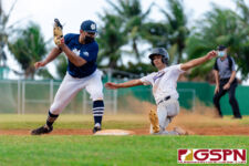 GW Gecko Javen Pangelinan slides back to first base before ND Royal Noah Peredo can make the tag. (Photo by Michael Blas)