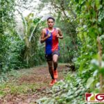 St. John's Knight Tamondong Darren enters the jungle portion of the JFK trail. (Photo by Michael Blas)