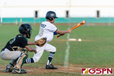 ND Royal Nico Velez bunts the ball to advance teammate Ethan Lizama to third base. (Photo by Michael Blas)