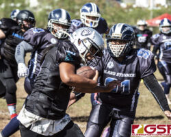 Sindalu Raiders Leticia Blas carries the pigskin through a swarm of Island Stunnerz defense. (photo by Bout It Productions)