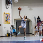 Academy Cougar Annika Almorio catches a fast break against the St. Paul Warriors. ( photo by Bout It Productions )