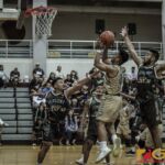 Team Elite's Thelo Orichiro shoots for two between Team Supreme's defense. (photo by Bout It Productions)