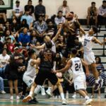 FD Friars Tony Quinene attacks the basket while St. Paul Warriors Nich Fermin and Reo Aiken look to block. (Photo by Michael Blas)