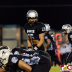 Sanchez Shark QB Jayton Penaflor sets up the offense for the first play of the game. (Photo by Michael Blas)