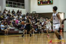 JFK Islanders Francis Borja takes the ball down court looking for an open man. ( photo by Bout It Productions )