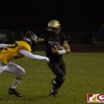 Tiyan Titans Davin Mojica stiff arms the defender after receiving the kickoff. (photo by Bout It Productions)