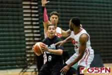 Wu Tangs Jay Casimiro looks for the bucket while being doubled by KFC Bombers Jared Glenzer and Divine Cox. (Photo by Michael Blas)