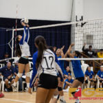 St. Paul Christian Warrior's Kirsten Silva launches ball over to the Norte Dame Royals. (Photo by Michael Blas)