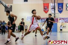 Okkodo Bulldog Rylen Cajigal breaks through the Islander defense for a shot at the basket. (Photo by Michael Blas)