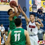 JFK Islanders Jerry Ngraremiang stops and pops for a shot behind the free throw line while Okkodo Bulldogs Kevin Cabral contests. (Photo by Michael Blas)
