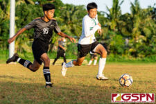 JFK Islander Andrew Choi and Sanchez Shark midfielder chase the ball down for possession. (Photo by Michael Blas)