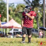 Faha Outlaws Jose Takai is all smiles while enjoying the game with his teammates. (photo by Bout It Productions)