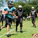 Southern Dolphin QB Ethaniel Escuadra takes the ball to the sidelines for a touchdown. (Photo by Michael Blas)