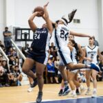 Academy Cougars Nicole Gardaoli takes a shot at the hoop while Niah Siguenza gets a hand on the ball. (Photo by Michael Blas)