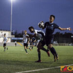 Isaiah Macalma tries to control the ball by the aggressiveness of John Halili. (photo by Michael Ebio)