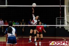 St. John's Knight Ella Wigsten gets the ball over the net in the first set of the game. (Photo by Michael Blas)
