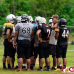 The Simon Sanchez Sharks run a couple of plays during practice in preparation for the 2019 IIAAG High School Football Season. (Photo by Michael Blas)