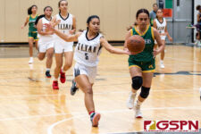 Tiyan Titan Ally Angoco tips the ball off the hands of JFK Islander KJ Camacho. (Photo by Michael Blas)