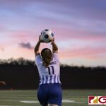 Guam High Panthers Ashlee Schoenhals sends the ball off to her teammate. (photo by Bout It Productions)