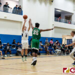 Harvest Eagles Chase Keith on a jumper while JFK Islanders Lawrence Tisalong contests. (Photo by Michael Blas)