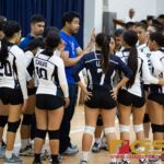 St. Paul Warriors coach Neil Pineda talks to his team at the end of the first set. (Photo by Michael Blas)