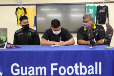 Ian Becker, a 2021 graduate of Simon Sanchez High School, signs a letter of intent to play men's intercollegiate soccer for the Carroll College Saints beginning this fall season during a signing event at the Guam Football Association National Training Center Lecture Hall, organized by Community First/Days Inn Dededo Soccer Club Friday afternoon. Carroll College, in Helena, Montana, competes in the Cascade Collegiate Conference of the NAIA.