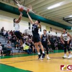 JFK Islanders Jerry Ngiraremiang with a fade away jumper while St. Paul Warriors Audrey Dela Cruz contests. (Photo by Michael Blas)