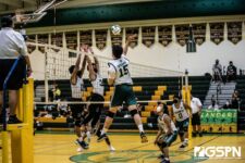 JFK Islander Dean Weilbacher sends the ball across the Tiyan Titans defenders. Photo by Bout It Productions
