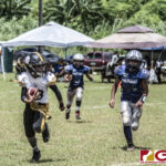Tamuning Steelers Kayler Ignacio looks for an opening on the sidelines. (photo by Bout It Productions)
