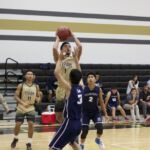 Franklin Taijeron (#1 shooting) takes a shot over Jiandong Lin of (#3) of the Harvest Eagles. (photo by Raine Delos Reyes)