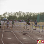 This Friday's IIAAG Track & Field Meet moves to the ocean scenery of J.F.K High. The sweltering heat was on but the fans and athletes still put on a show. (photo by Bout It Productions)