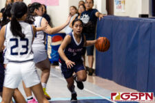 Okkodo Bulldog Racquel Camacho dribbles after grabbing the offensive rebound. (Photo by Michael Blas)