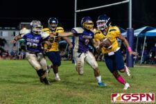 GW Gecko William Rios and Joshua Dela Cruz close in on Panther QB travon Jacobs in the endzone. (Photo by Michael Blas)