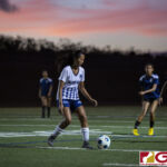 Guam High Panthers Jayden Palomares finds herself surrounded by a flank of Cougars. (photo by Bout It Productions)