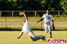 GW Gecko Ashton Tedtaotao makes a diving catch in the third inning of the game. (Photo by Michael Blas)