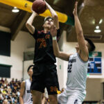 FD Friars Matt Fegurgur takes a shot from under the rim after grabbing the offensive rebound. (Photo by Michael Blas)