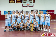 The St. Paul Warriors pose after receiving their 2019 GSPN Preseason Boys Basketball Tournament trophy. (Photo by Michael Blas)