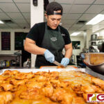Boka Box Nutrition Professional/Owner Jesse E. Rosario prepares a set of meals during their daily meal prep. (Photo by Michael Blas)
