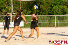 St. John's Knight Tylee Shepherd sets the ball for teammate Austia Mendiola. (Photo by Michael Blas)