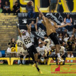 Tiyan Titan's Juan Duenas and JFK Islander's Justin Camacho both reach for the ball near the end of the third quarter. (Photo by Michael Blas)