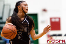 St. Paul Warrior Jan Quintanilla sets the play up in the fourth quarter of the game. (Photo by Michael Blas)