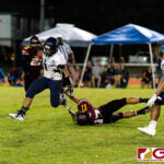 Guam High Panther RB Julius Gadouang slips through a defender for positive yardage on the play. (Photo by Michael Blas)