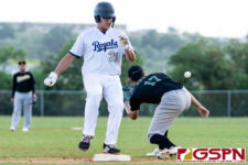 ND Royal Noah Pereda walks onto third base before the ball can reach the baseman John Cruz. (Photo by Michael Blas)