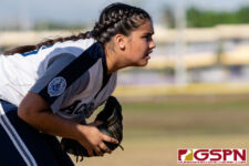 Academy Cougar Olivia Salas gets set on defense in hte second inning of the game. (Photo by Michael Blas)