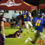 George Washington Gecko's Christian Cabrera (#21) scores a touchdown after intercepting the ball. (Photo by Michael Blas)