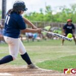 ADZtechs Meagan Maratita connects with the ball in the 4th inning of the APL Women's Fast Pitch game against the Islanders. (Photo by Michael Blas)